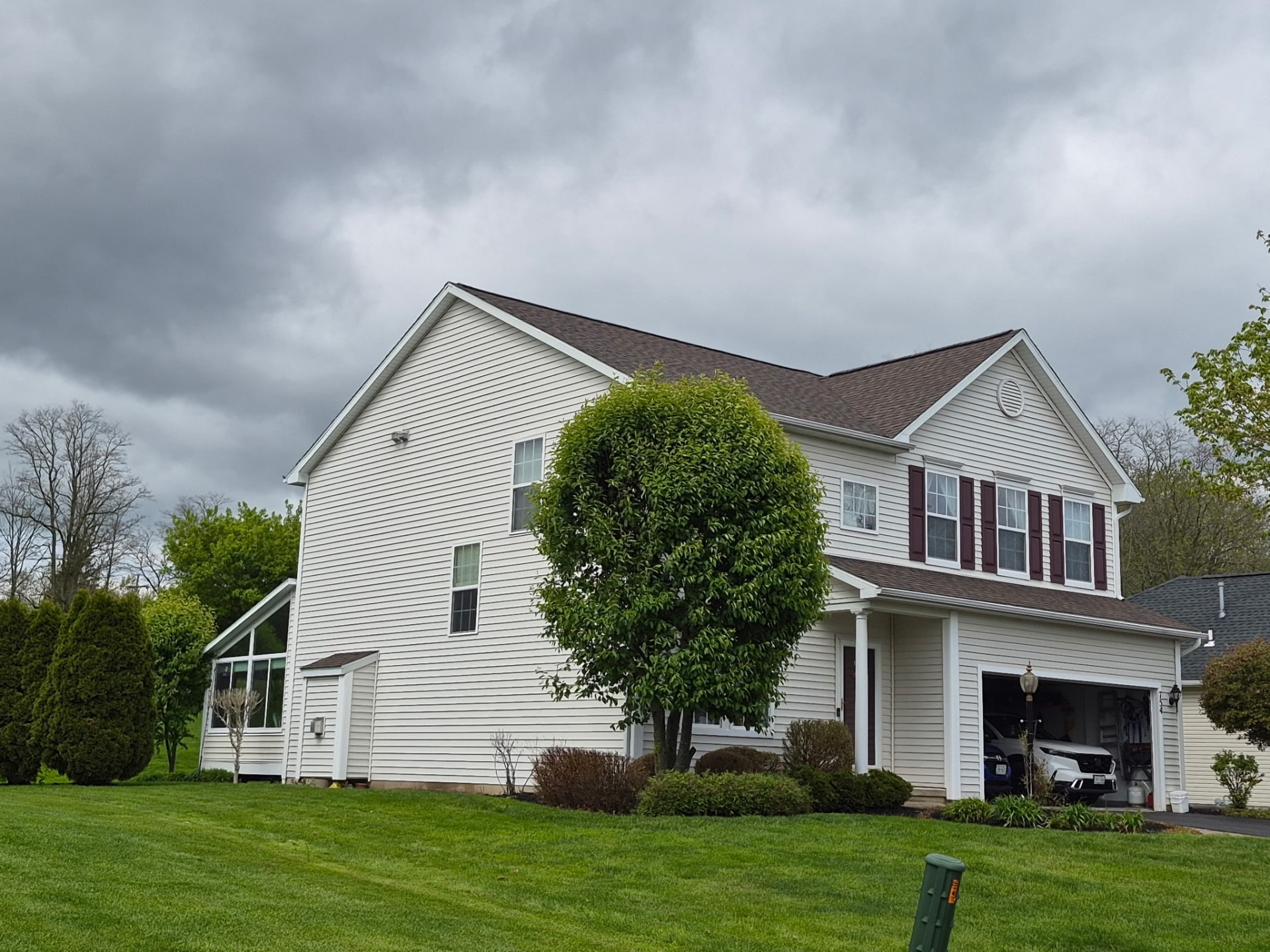 Completed asphalt roof replacement on a Rochester-area home